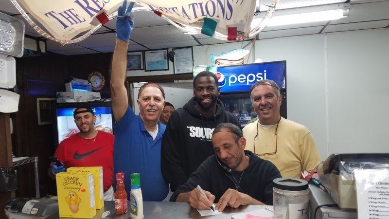The Crack Chicken family and crew at their Lansing restaurant